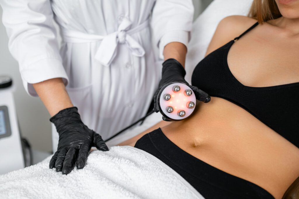 Belly fat reduction is the focus as a young woman undergoes RF body cavitation lifting.