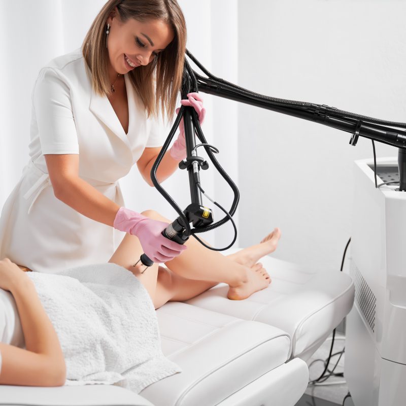 Laser thigh skin care in beauty salon.